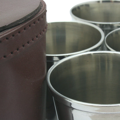 4 Metal Cups beside a leather case