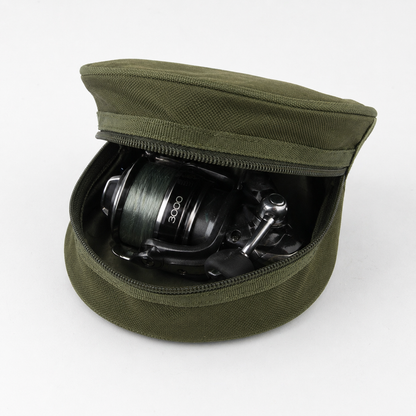 Green fishing reel case with a fishing reel inside on a white background